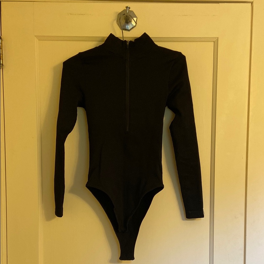 Women’s black quarter zip spandex body suit